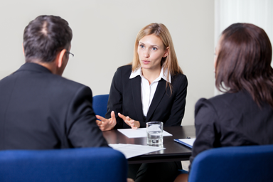 Attorney having a discussion with her two clients